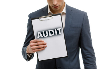 A businessman shows an inscription: AUDIT