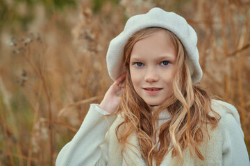 child in autumn clothes