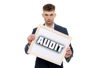 A businessman shows an inscription: AUDIT