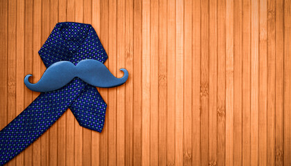 Prostate cancer symbol. Black mustache on a blue man's tie.