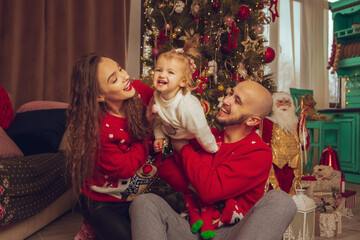 Funny family with daughter celebrate New year and Christmas