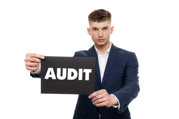 A businessman shows an inscription: AUDIT