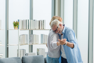 Elderly couple dancing together with happy and romantic emotion.