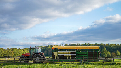 Tractor with a cattle trailer at the farm