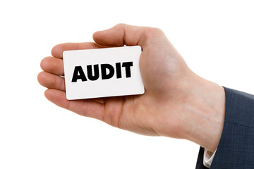 A businessman shows an inscription: AUDIT