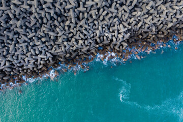 Top down view of the wave breaker over the sea - Powered by Adobe