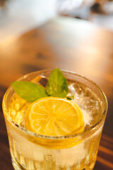 cold drink orange soda with ice, beverage cocktail on cafe table, juice refreshment