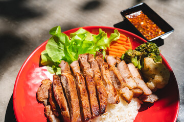 Thai style grilled pork with rice and vegetable, meal meat for dinner or lunch main dishes