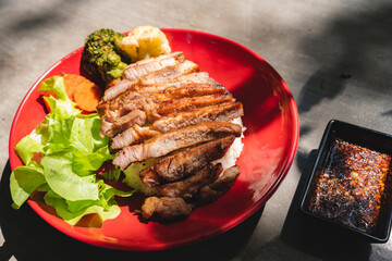 Thai style grilled pork with rice and vegetable, meal meat for dinner or lunch main dishes