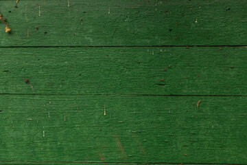 Old boards painted green red. Background texture