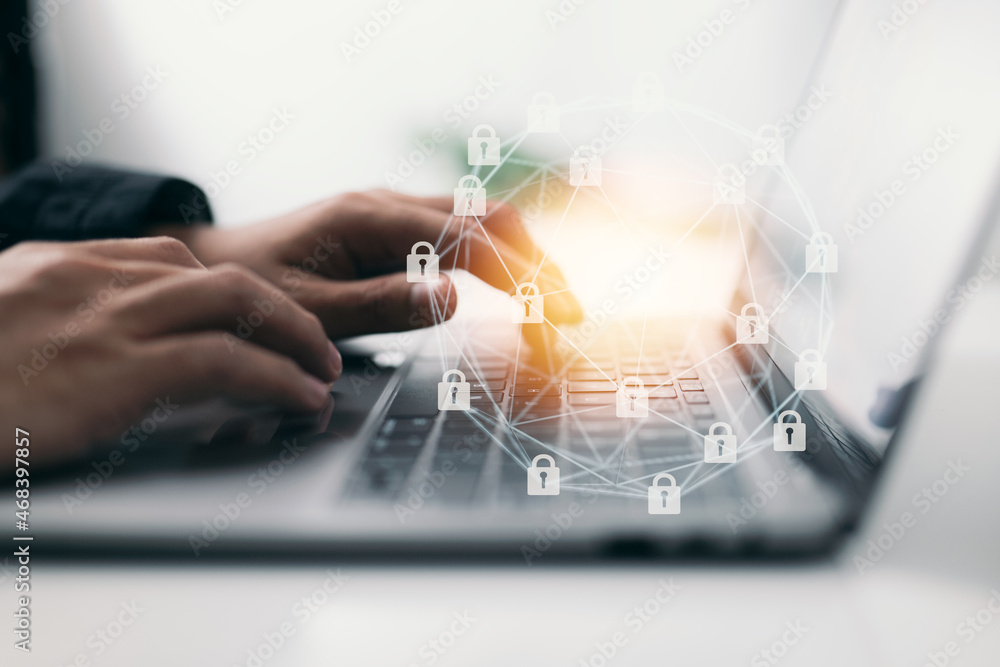 Poster the security system. Male hand typing on a keyboard, from the side. Business, technology, the internet, and networking are all concepts that are discussed in this article.