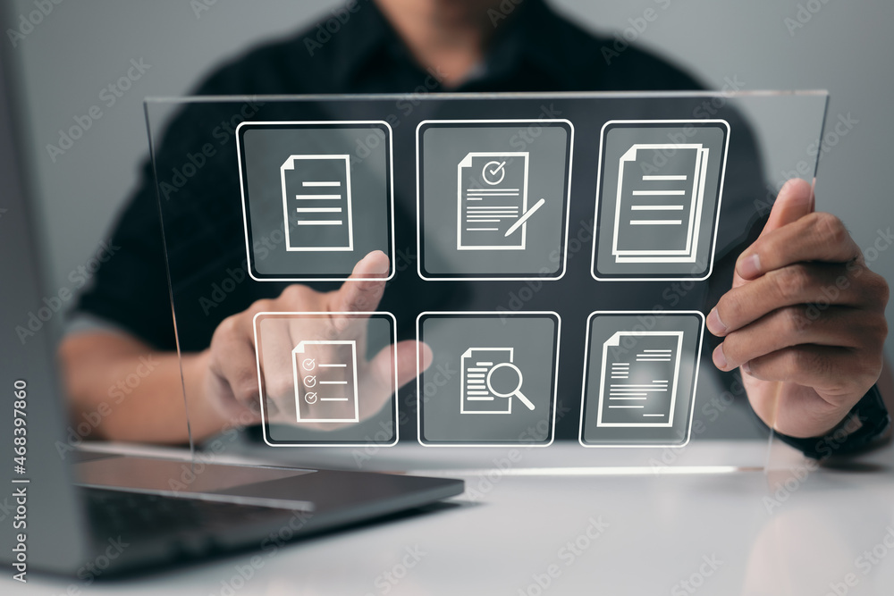 Fototapete Businessman works on a virtual screen. To manage files more efficiently, automate processes. Concept of an online documentation database and document management system.