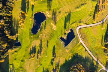 Aerial autumn fall sunny day view of golf course field