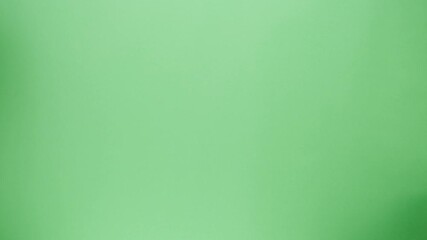 Square cardboard boxes on green background. Preparing take away meals. Online contactless food shopping. Food delivery service. Courier taking order, delivering to customer. 