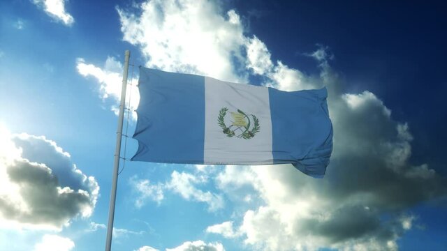 Flag of Guatemala waving at wind against beautiful blue sky