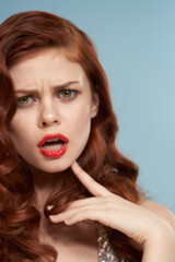 attractive red-haired woman red lips face close up