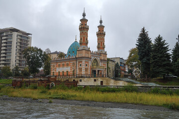 Old Sunni Mosque (Mukhtarov Mosque) in the cityscape on a cloudy October day, Vladikavkaz