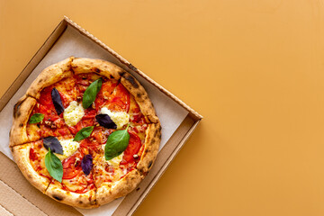 Italian pizza with tomatoes cheese and basil, top view