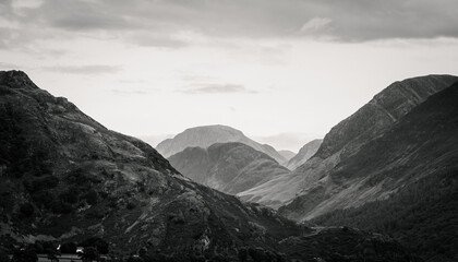 A monochrome landscape photograph of the southern fells of Buttermere Valley in The Lake District, Cumbria.