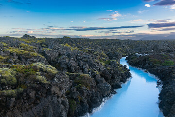 Fototapeta na wymiar Iceland volcano stone bright blue river landscape
