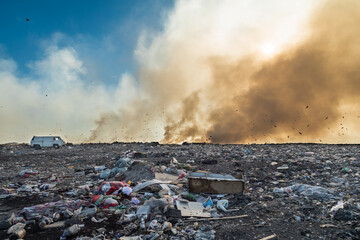 Landfill with burning trash piles. Environment pollution concept