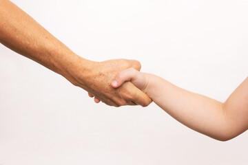 Handshake between a caucasian adult woman and a small child isolated on a white background. Agreement, arrangement, friendship, family. Different generations