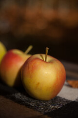 Ripe red apples on the table. Blurred background. 