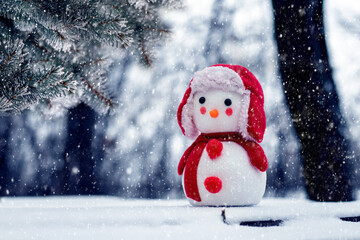 Snowman in the winter forest during a snowfall. Greeting Christmas and New Year card with snowmen