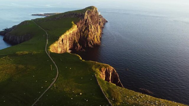 Aerial of Neist Point lighthouse at sunset - Scotland - Highlands - Isle of Skye