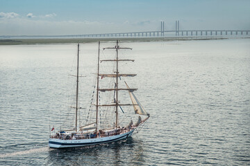 Tall sailing ship at the Öresund bridge between Copenhagen and Malmo