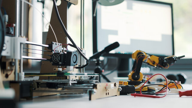 3D printer and tools on the laboratory desk