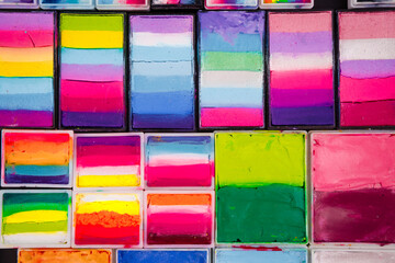 Bright children's face painting. Bright background. 