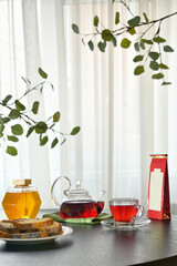 Close Up Of Tea Cup And Teapot on Table