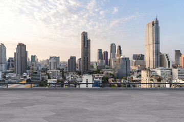 Panoramic Bangkok skyline view, concrete observatory deck on rooftop, sunset. Luxury Asian...