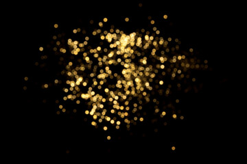 Golden blurred bokeh lights on black background. Glitter sparkle stars for celebrate. Overlay for...