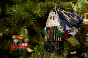 A home made Christmas ornament in an evergreen tree