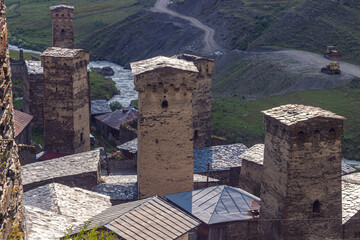 Fototapeta na wymiar Svaneti, Georgia. Ancient village Ushguli in Caucasian mountains. Svan towers in Mestia region and mountain landscape on background. 