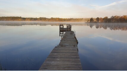 Obraz premium Beautiful Morning at the foggy lake