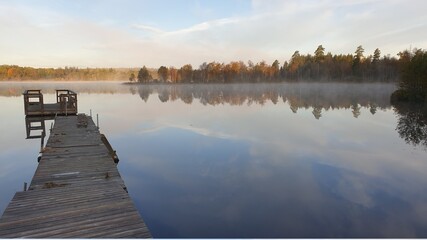 Obraz na płótnie Canvas Beautiful Morning at the foggy lake