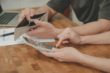 Stressed, Problem asian young couple love calculate loan, holding and open empty wallet not have...
