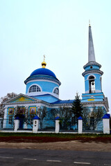 Photo of a rural Orthodox Church with a bell tower