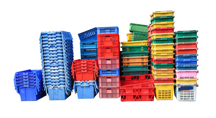 Empty old plastic crates of many colors. Several sizes stacked on a white background. Isolated.