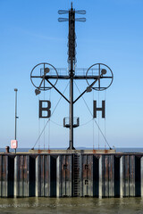 Wind semaphore in Bremerhaven, Germany. The almost 20 m tall mast shows the wind force and wind...