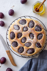 Plum pie on a white background. Baking. Vegetarian food.