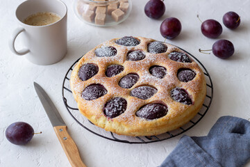 Plum pie on a white background. Baking. Vegetarian food.