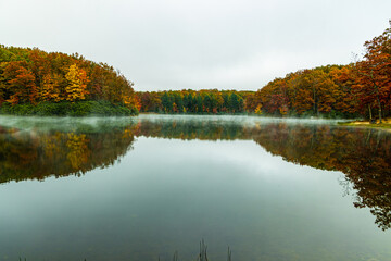 Fall Color Reflections on The Misty Surface Of Boley Lake, Babcock State Park, West Virginia, USA