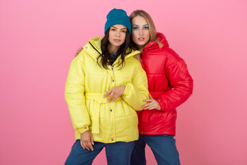 pretty women friends in colorful down jacket