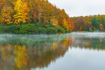 Fall Color Reflections on The Misty Surface Of Boley Lake, Babcock State Park, West Virginia, USA