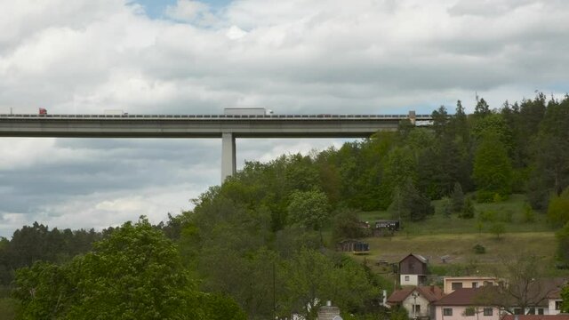Flowing naturally the River in the forest and the old stone bridge over it. Europe Czechia Nature Forest and river landscape.