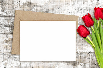 Paper letter card mockup red tulip flowers Floral flat lay